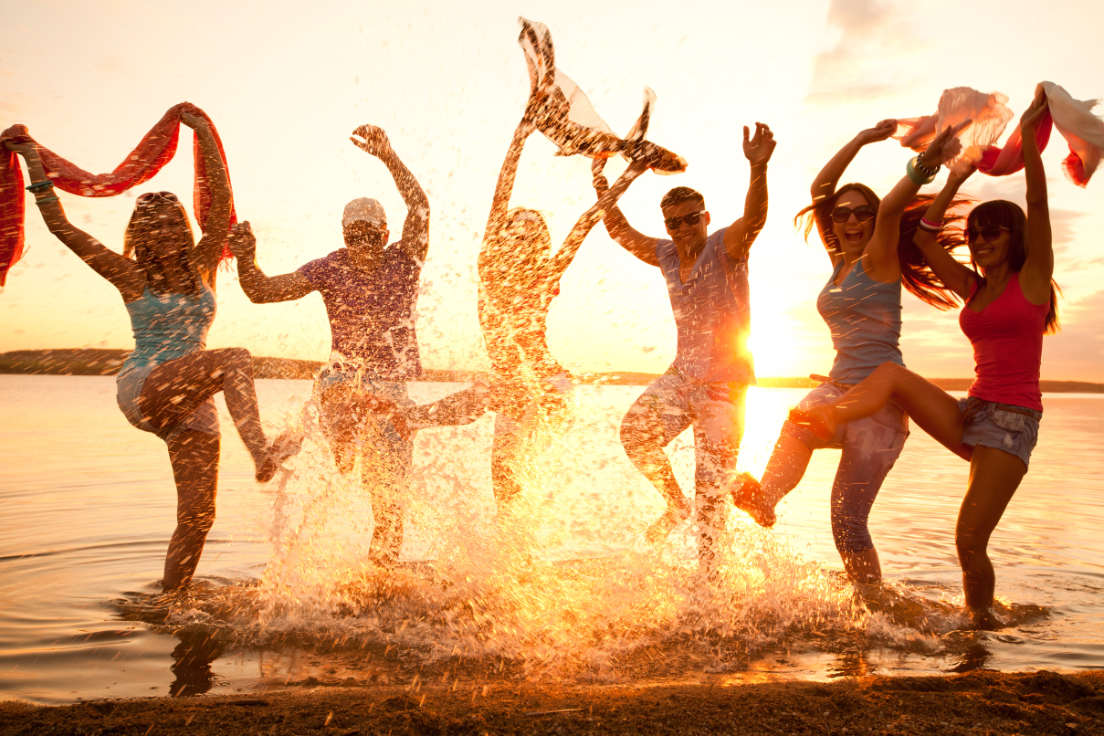 A group of young people are having fun at the beach