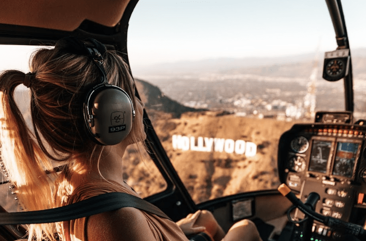 A woman enjoying her Tinggly experience gift - a Los Angeles helicopter ride tour